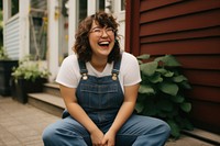 Laughing portrait outdoors sitting. 