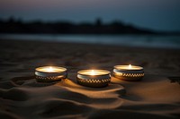 Candle light beach sand. 