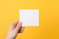 Paper hand holding yellow. AI generated Image by rawpixel.