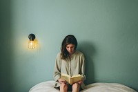 Woman reading book.  AI generated Image by rawpixel.
