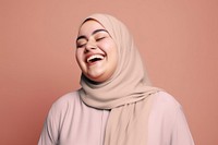 Muslim woman cheerfully laughing 