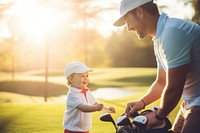 Dad playing golf with son. 