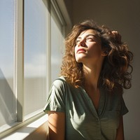 Window portrait looking adult. 