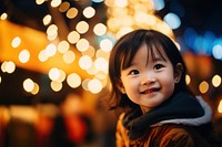 A happy asian female toddler smiling photography portrait light. 