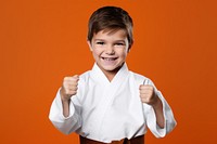 Smiling karate sports child. 