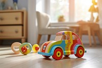 A colorful wooden toy car a male toddler playing in lving room vehicle.