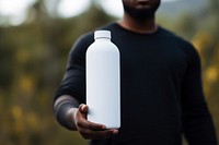 Bottle outdoors holding adult. AI generated Image by rawpixel.