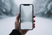 Holding winter white phone. 