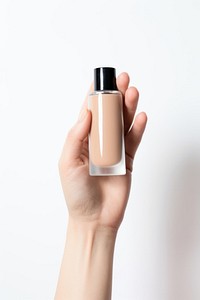 Cosmetics bottle holding hand.