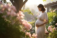 Pregnant standing outdoors nature. 