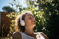 Headphones photography listening portrait. AI generated Image by rawpixel.