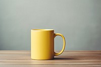 Coffee mug yellow table. 