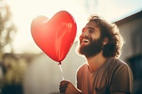 Love balloon smiling holding. 