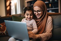 Laptop computer sitting family. 