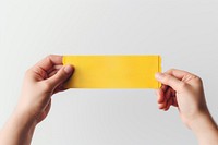 Ticket holding yellow paper. 