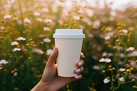 Coffee flower cup outdoors. AI generated Image by rawpixel.