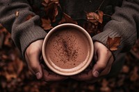 Hand chocolate holding coffee. 