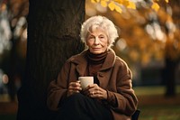 Sitting cup portrait outdoors. AI generated Image by rawpixel.