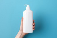 Bottle holding lotion blue. 