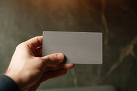 Business card holding indoors finger. 