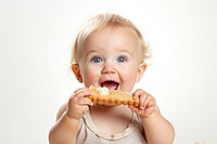 Eating baby biting food. 