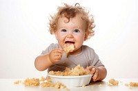 Eating baby food innocence. AI generated Image by rawpixel.