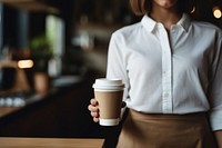 Coffee cup standing barista. 