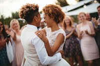 Dancing newlywed outdoors hugging. 