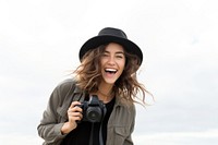 Camera laughing outdoors holding. AI generated Image by rawpixel.