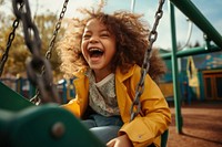 Playground laughing outdoors swing. 