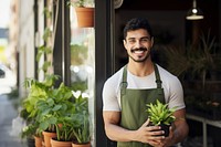 Plant smiling holding adult. 