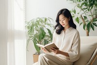 Reading sitting adult woman. AI generated Image by rawpixel.