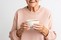 Sweater holding coffee drink. 