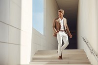 Businessman walking down the stairs. 