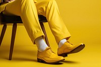 Yellow shoe footwear relaxation. 