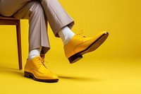 Yellow shoe footwear clothing. 