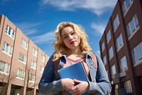 Student holding blonde female. 