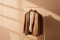 Jacket brown coat rack. AI generated Image by rawpixel.