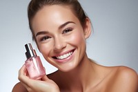 Cosmetics applying perfume smiling. 