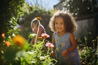 Garden child gardening outdoors. 