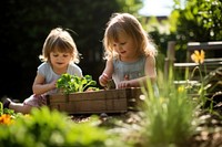 Garden child gardening outdoors. 