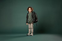 Backpack standing smiling child. 