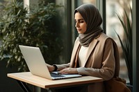 Woman working on laptop. 