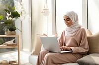 Woman working on laptop. 