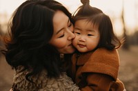 Kissing portrait outdoors toddler. 