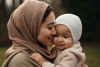 Portrait outdoors toddler kissing. 