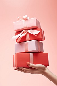 Present holding gift pink. 