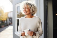 Cup sweater holding coffee. 