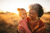 Grandmother grandchild portrait sunset. 