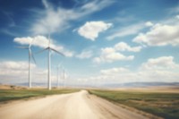 Blurred wind farm backdrop, alternative energy, natural light